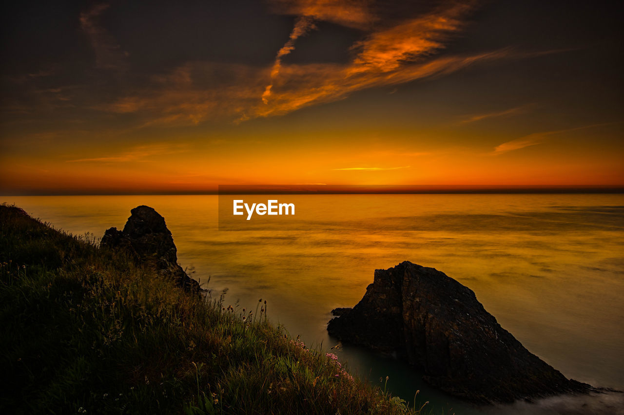 Scenic view of sea against sky during sunset