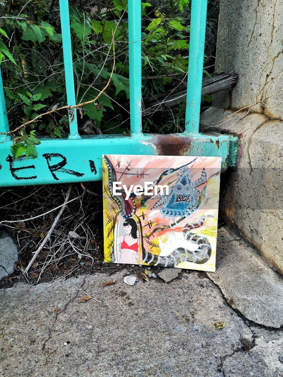 HIGH ANGLE VIEW OF GRAFFITI ON ABANDONED WALL