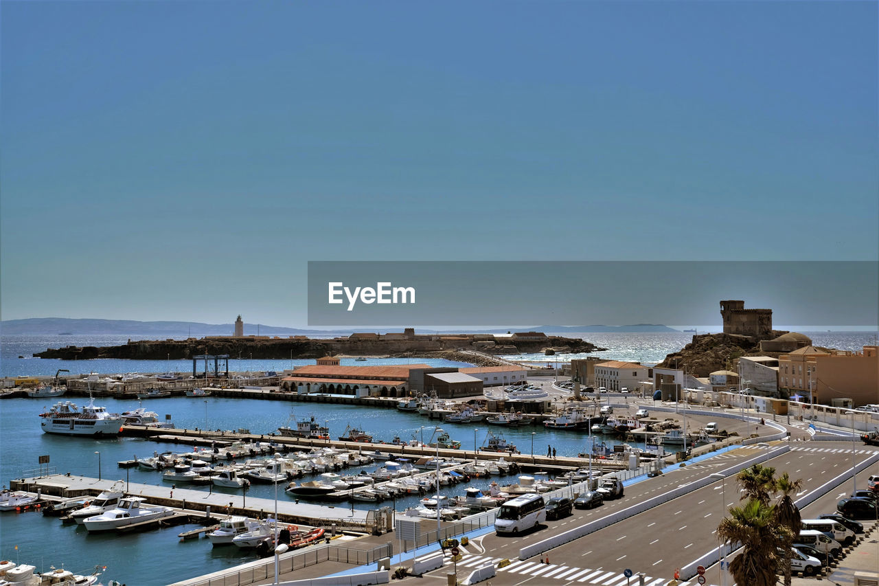 High angle view of harbor against clear blue sky