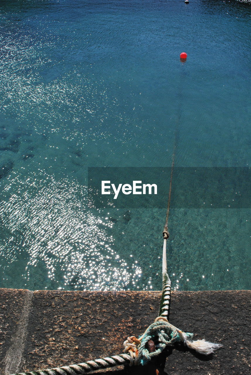 High angle view of fishing line from harbour 