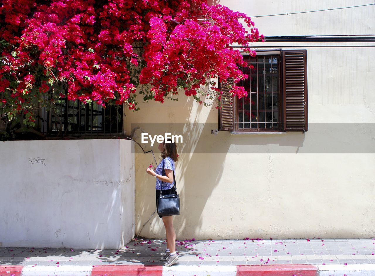 MAN WITH FLOWERS ON WOMAN