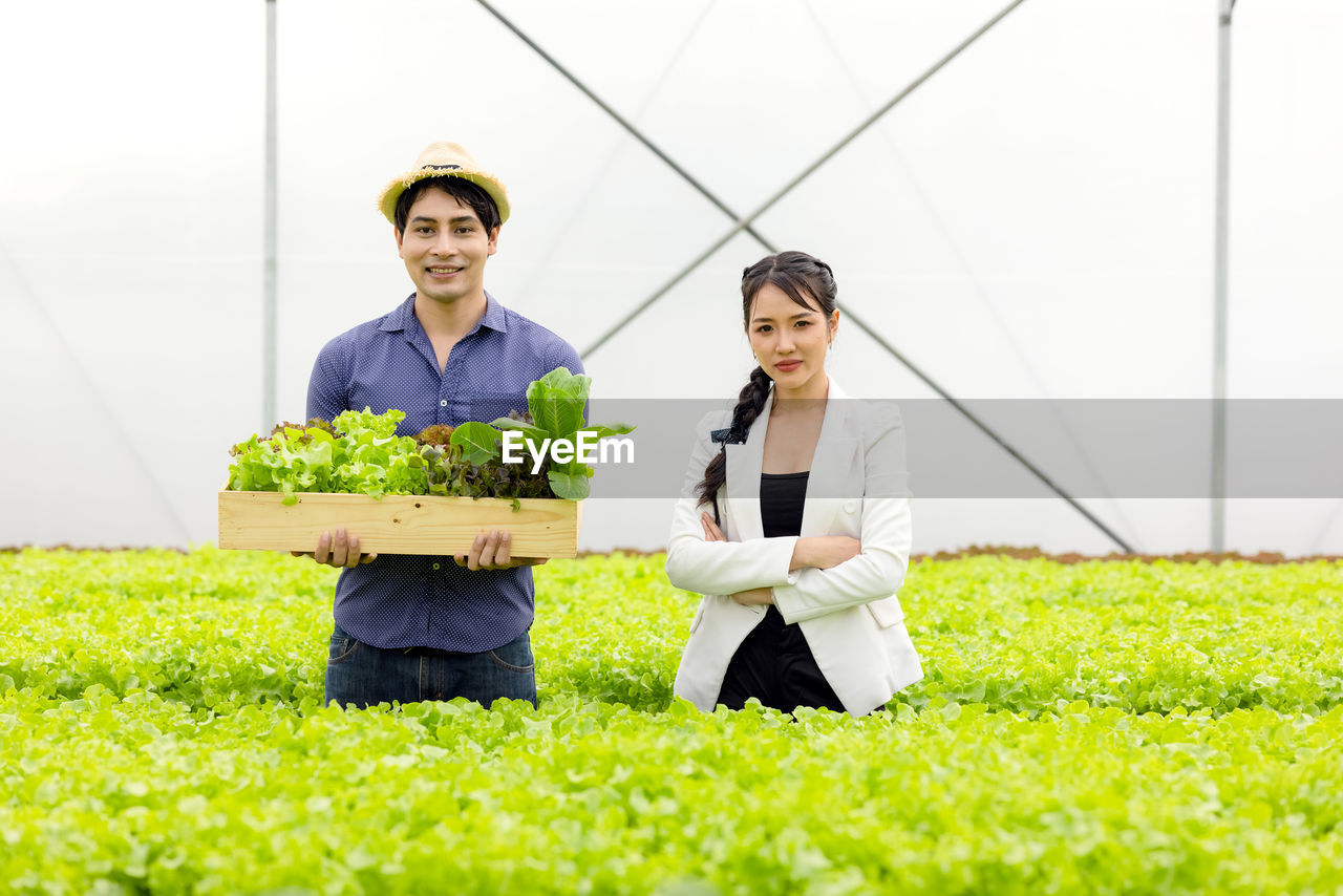 Portrait of a young couple standing outdoors