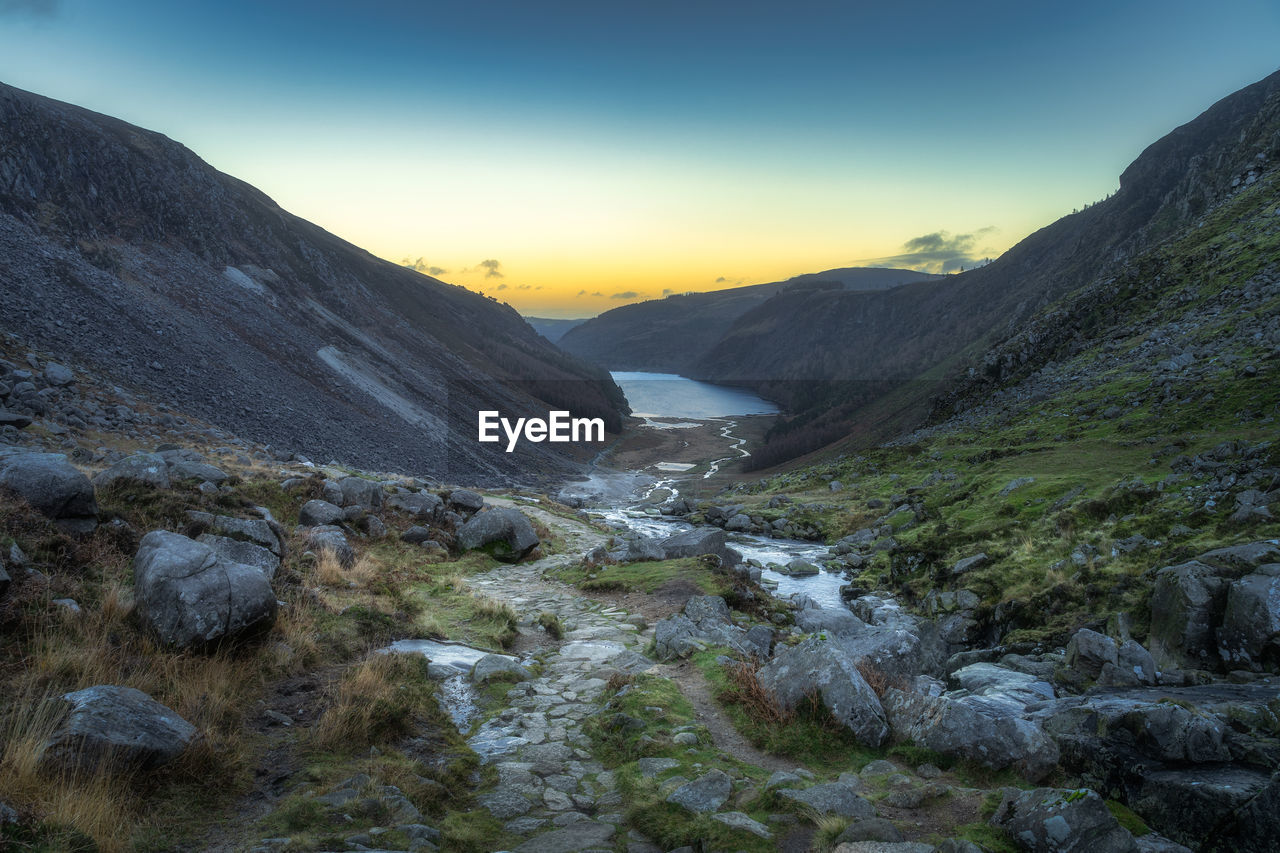 scenic view of landscape against sky during sunset