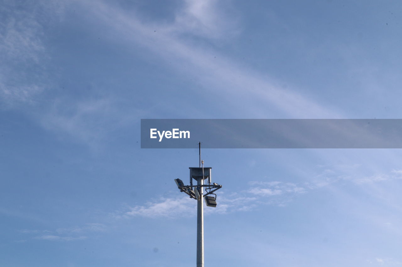 Low angle view of street light against sky