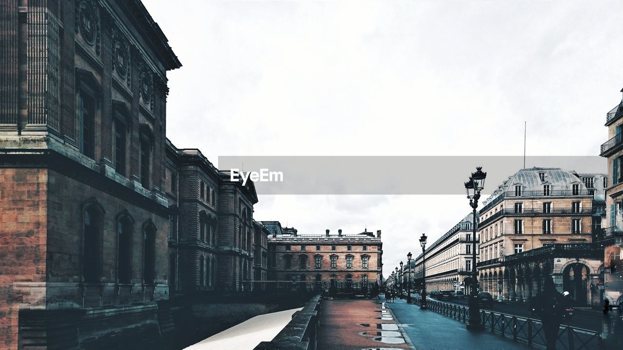 View of bridge in city against sky