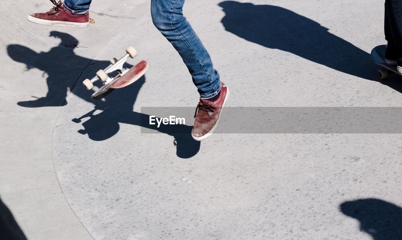 Low section of man skateboarding on sports ramp