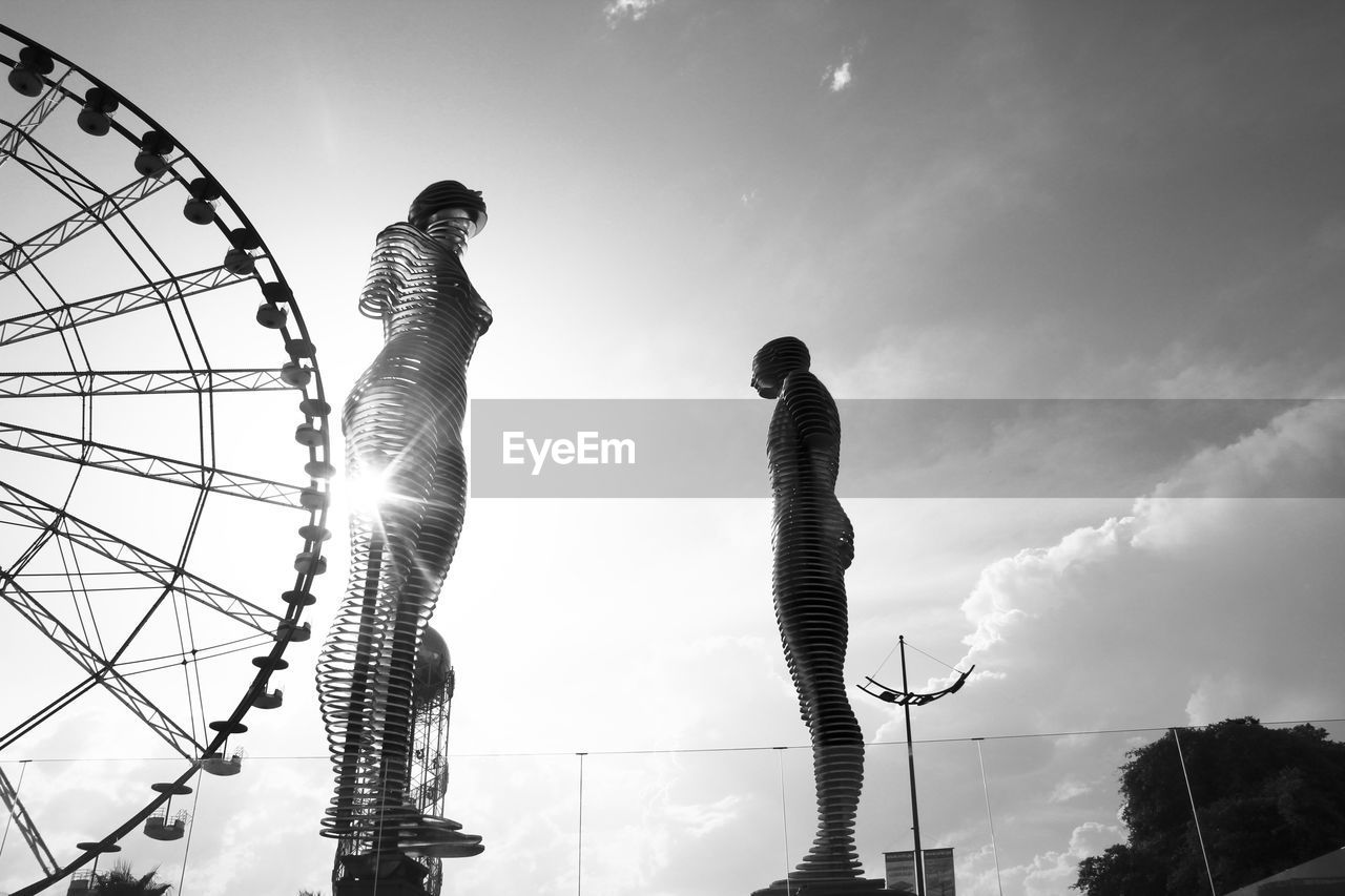 LOW ANGLE VIEW OF SCULPTURE AGAINST SKY