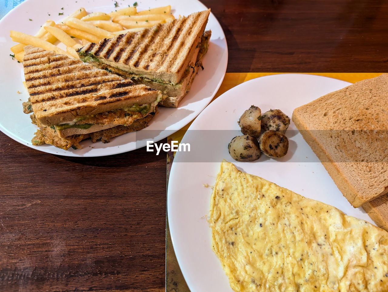 food and drink, food, dish, plate, freshness, fast food, table, breakfast, bread, wood, meal, healthy eating, no people, cuisine, produce, indoors, wellbeing, baked, high angle view, vegetable, still life