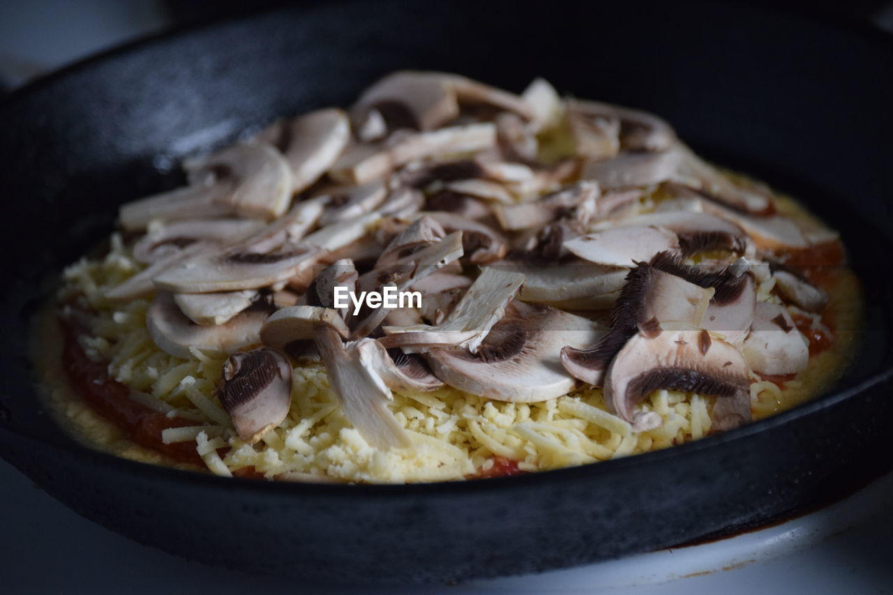 Close-up of meat in frying pan