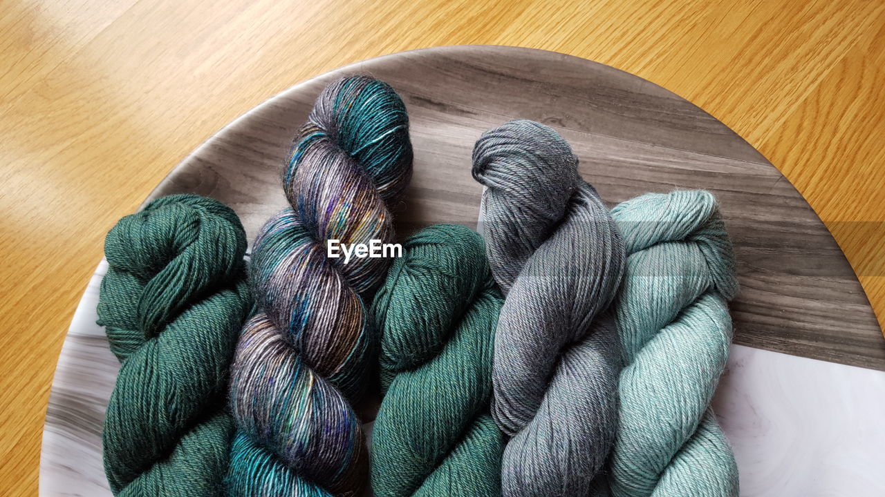 High angle view of multi colored yarn on table