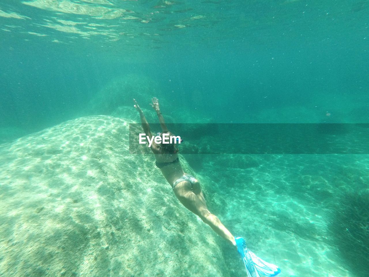 Woman swimming in sea