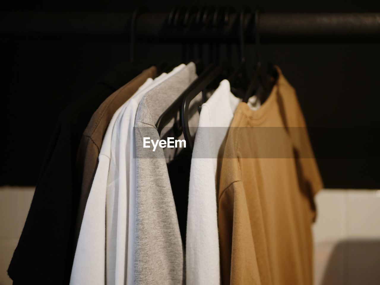 Close-up of clothes hanging in rack