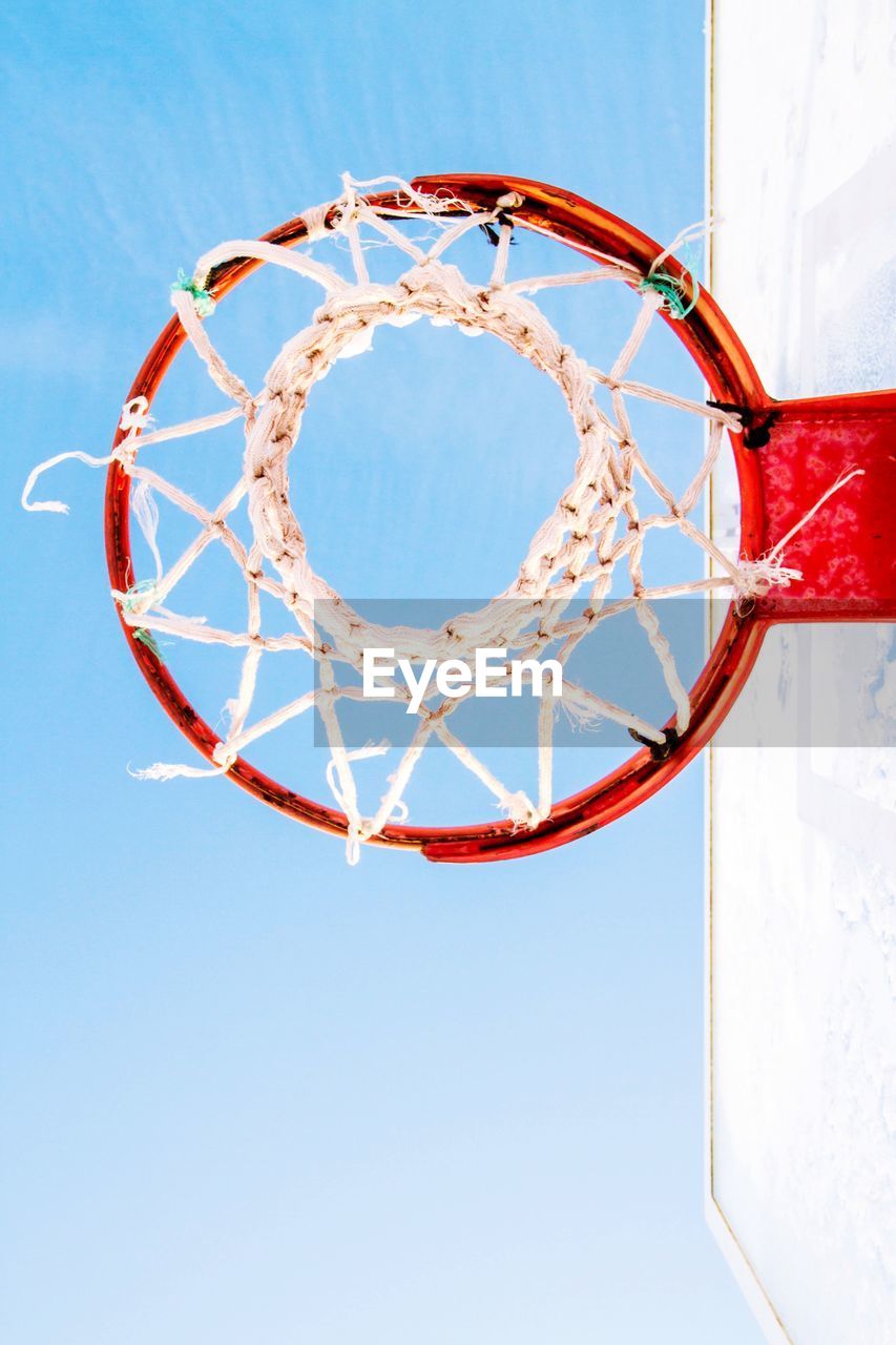 Directly below view of basketball hoop against clear sky