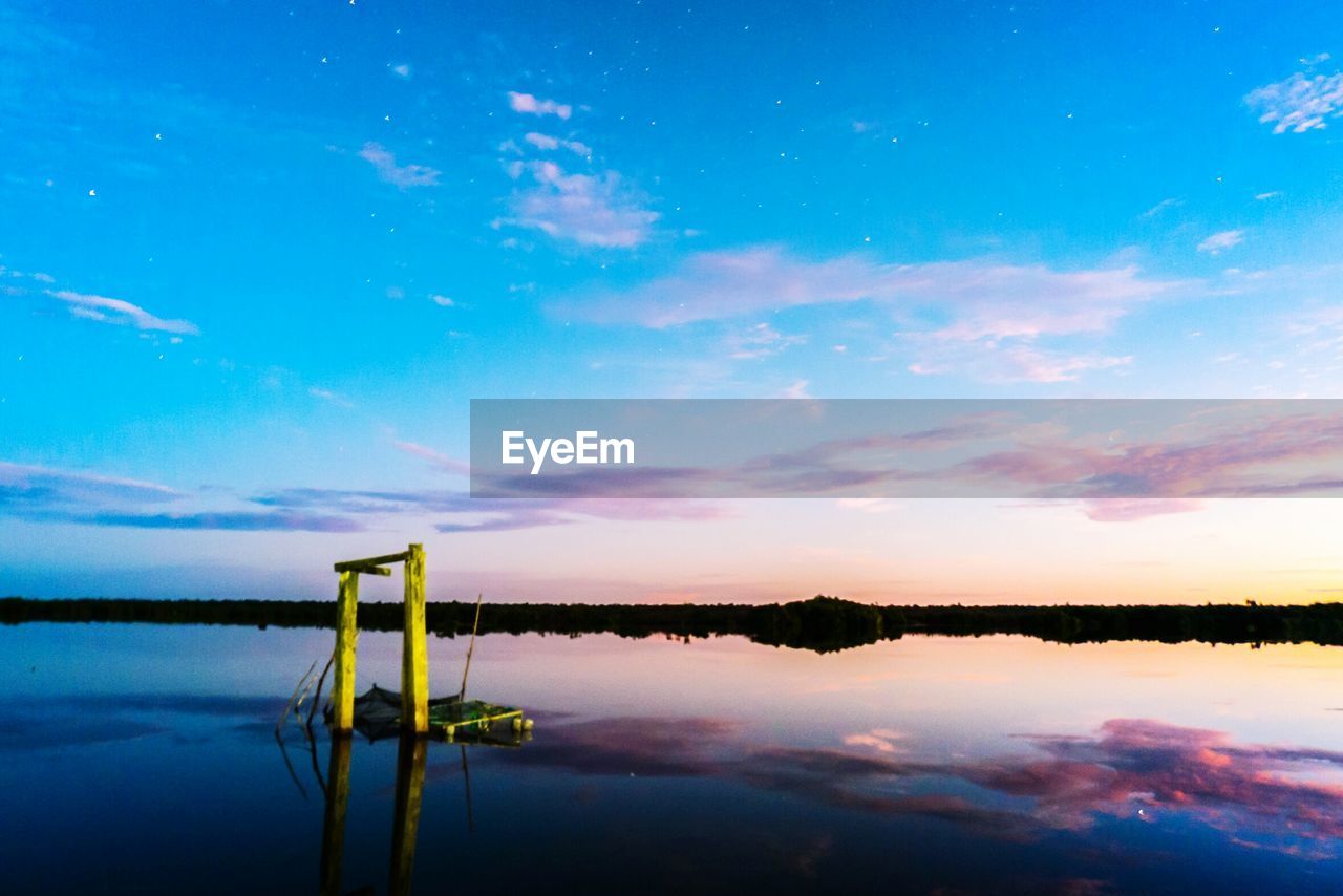 SCENIC SHOT OF REFLECTION OF CLOUDS IN WATER