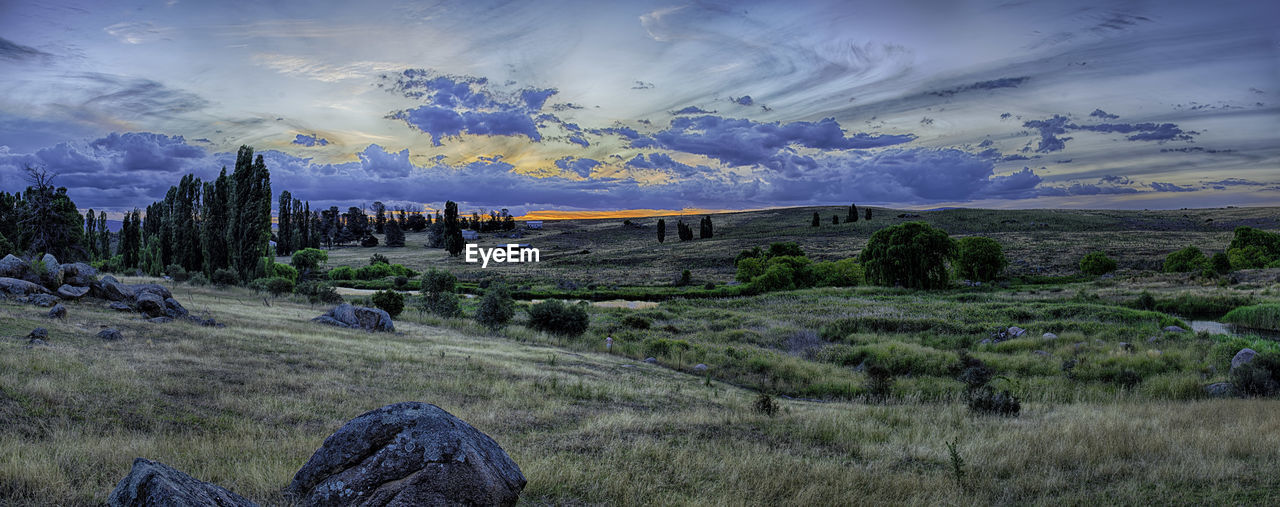 Panoramic view of landscape against sky during sunset