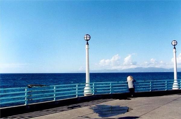 SCENIC VIEW OF SEA SEEN THROUGH RAILING