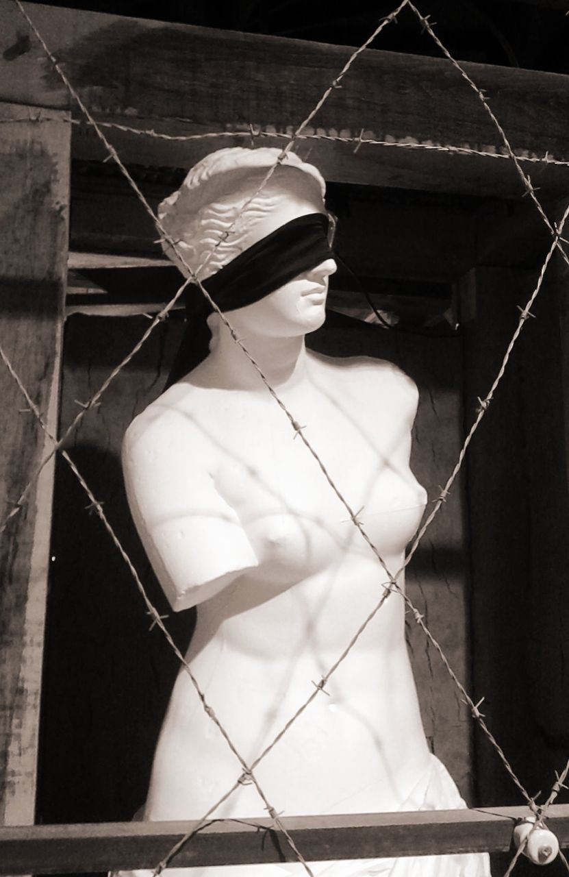 Sculpture with blindfold in museum