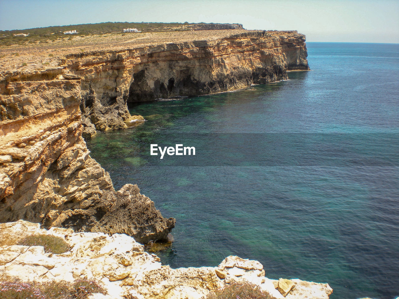 High angle view of rocks on sea against sky