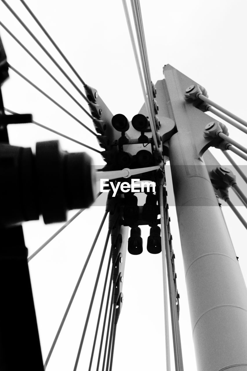 Low angle view of steel cables at bridge against sky