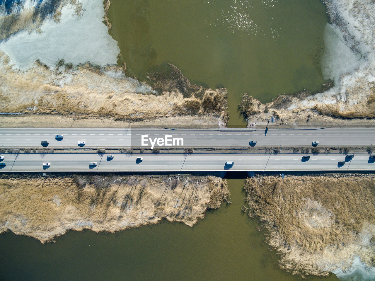 Directly above shot of vehicles on bridge over lake