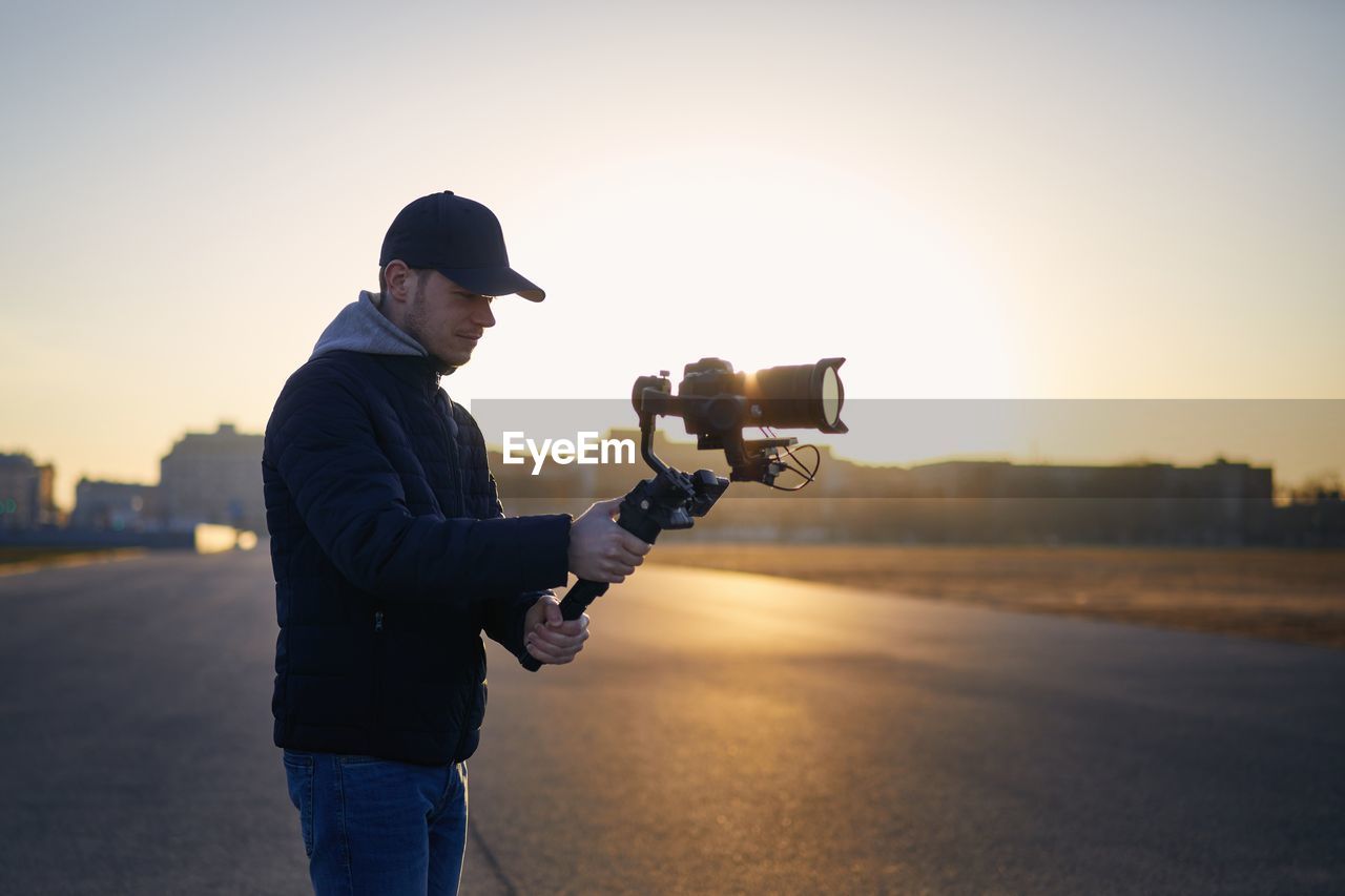 Side view of man photographing