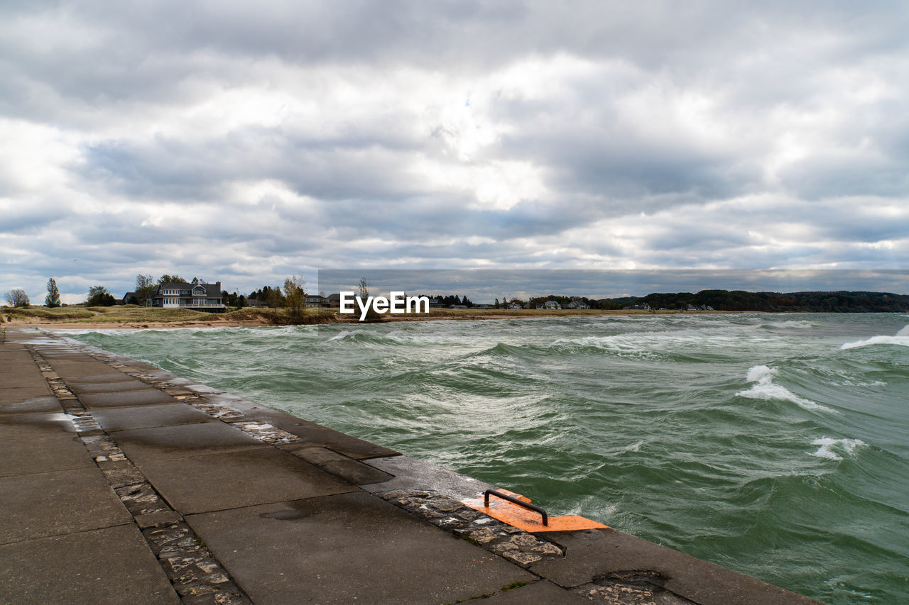 PANORAMIC VIEW OF BEACH AGAINST SKY