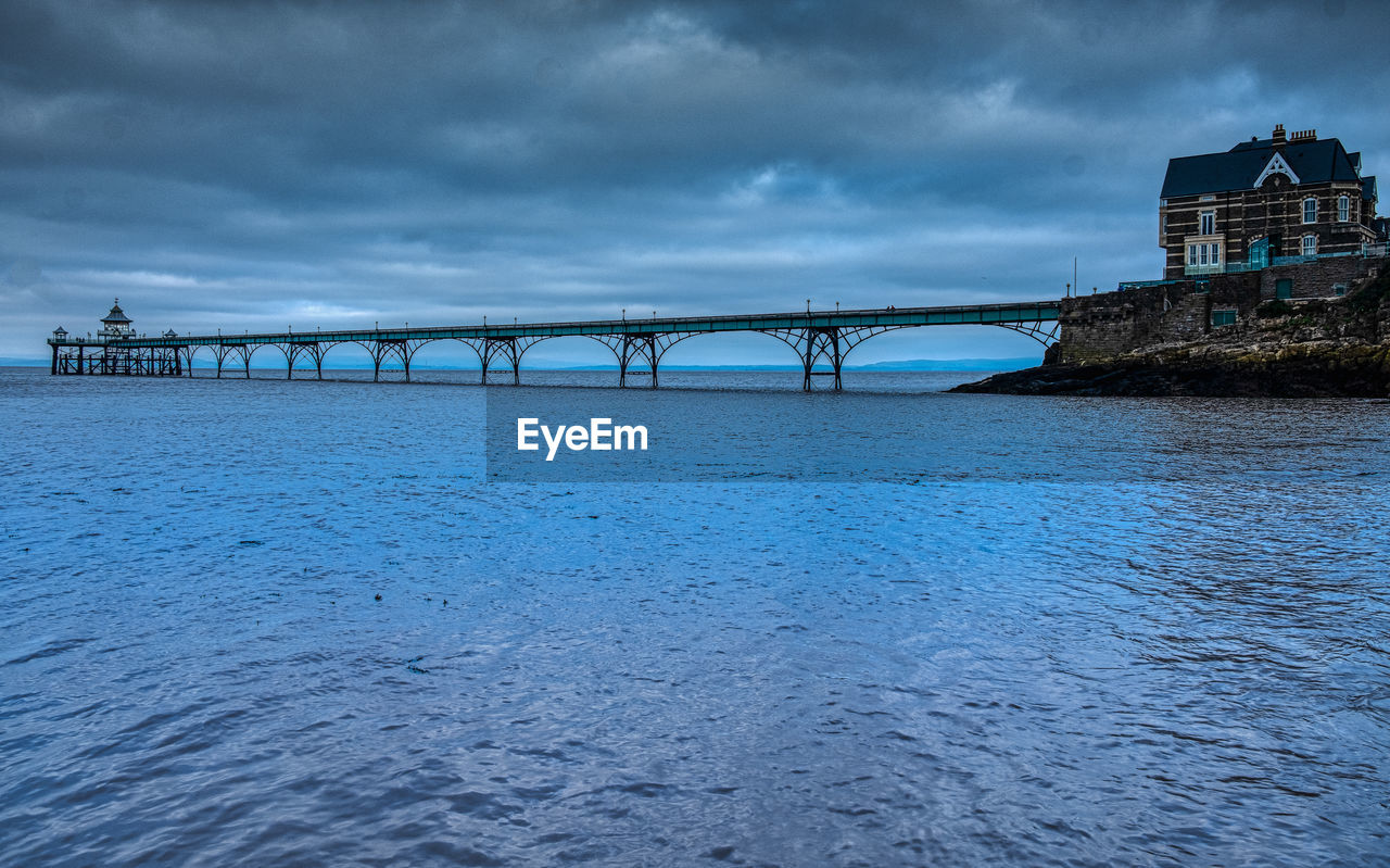 Bridge over river against sky