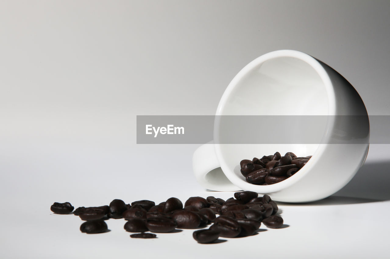 CLOSE-UP OF COFFEE BEANS IN GLASS