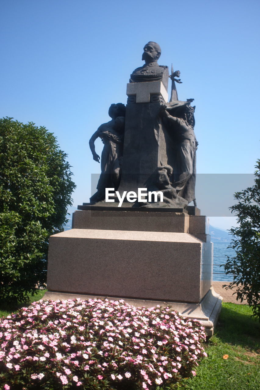 STATUE AGAINST CLEAR SKY