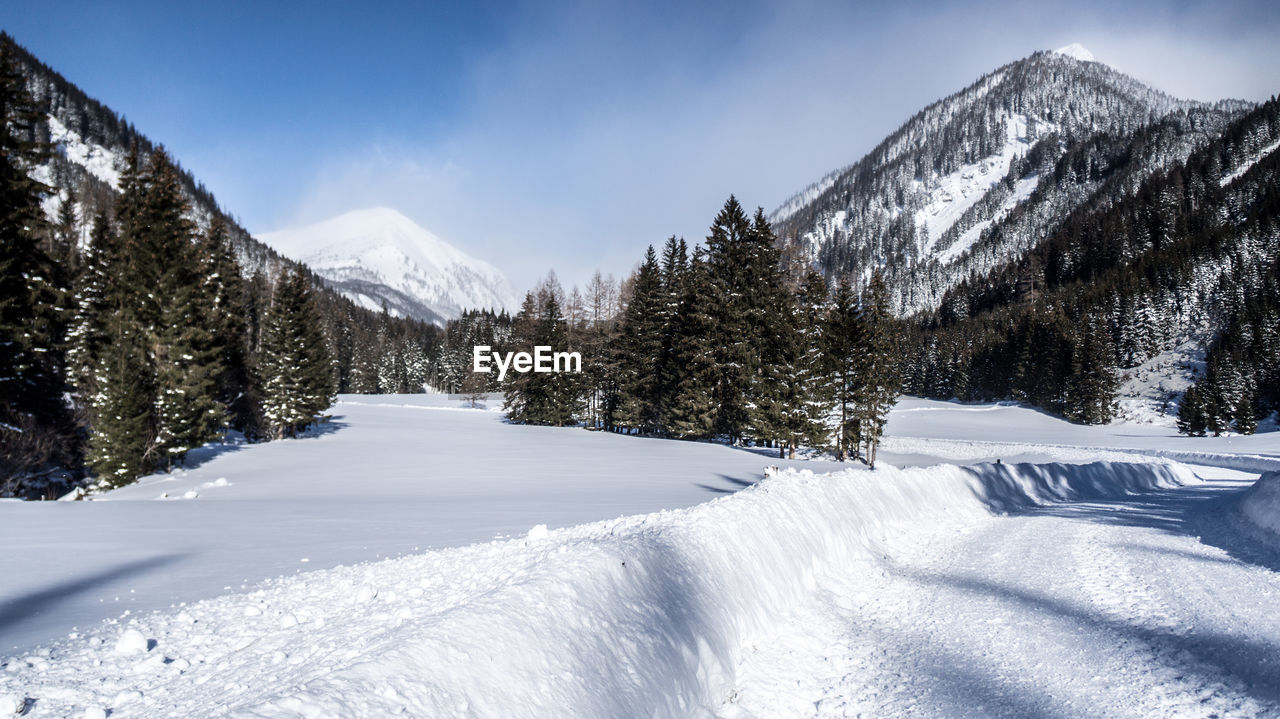 Scenic view of snowcapped mountains against sky