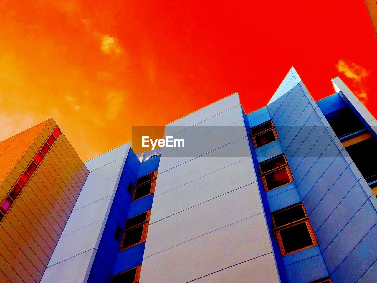 LOW ANGLE VIEW OF OFFICE BUILDING AGAINST SKY