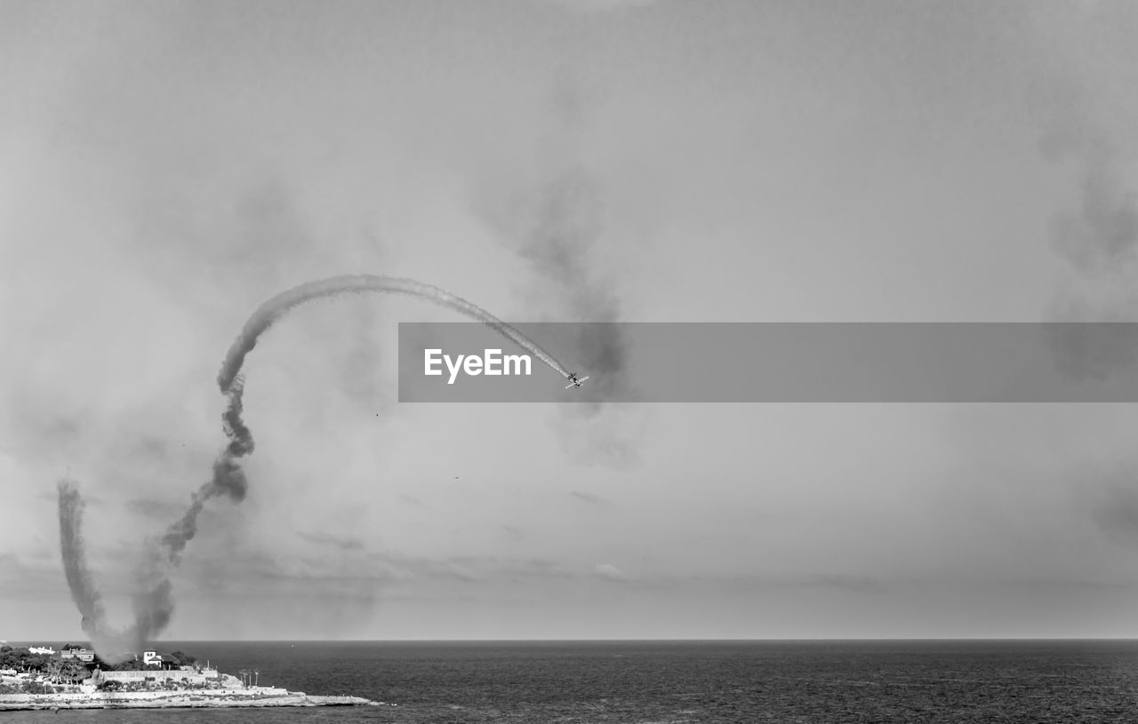 Scenic view of sea against sky airshow