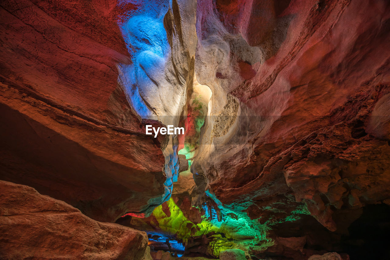 Rock formations in illuminated cave
