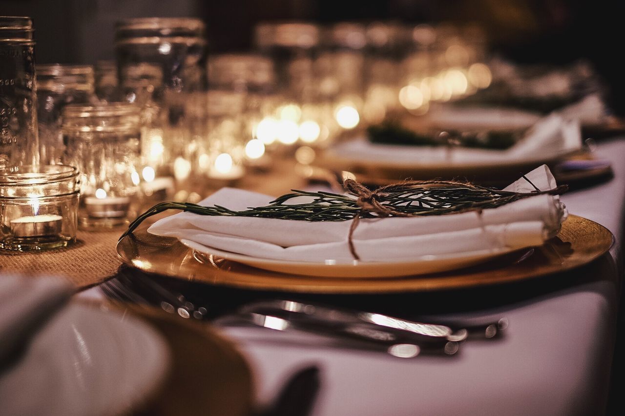 Close-up of herb on napkin over plate