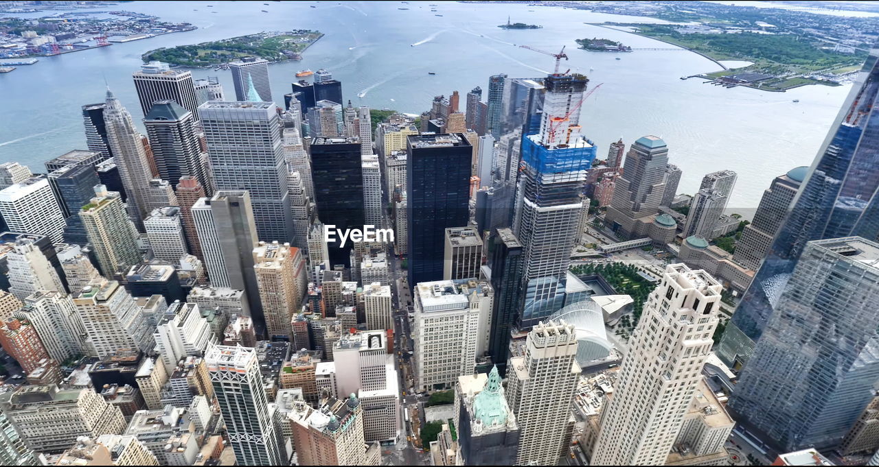 The statue of liberty with high-rise building in lower manhattan, new york city