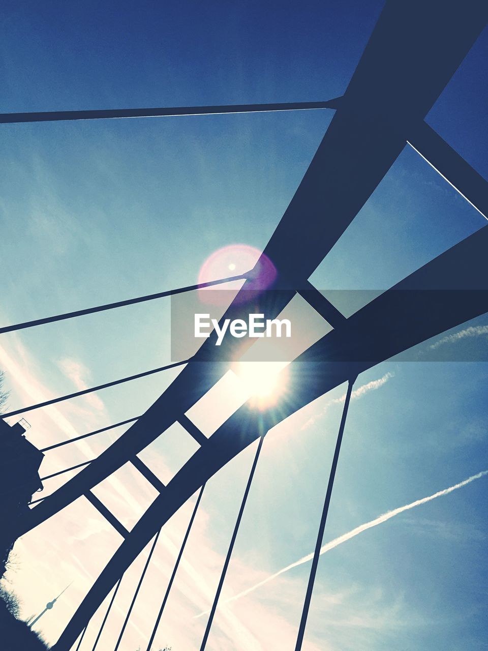 LOW ANGLE VIEW OF POWER LINES AGAINST BLUE SKY