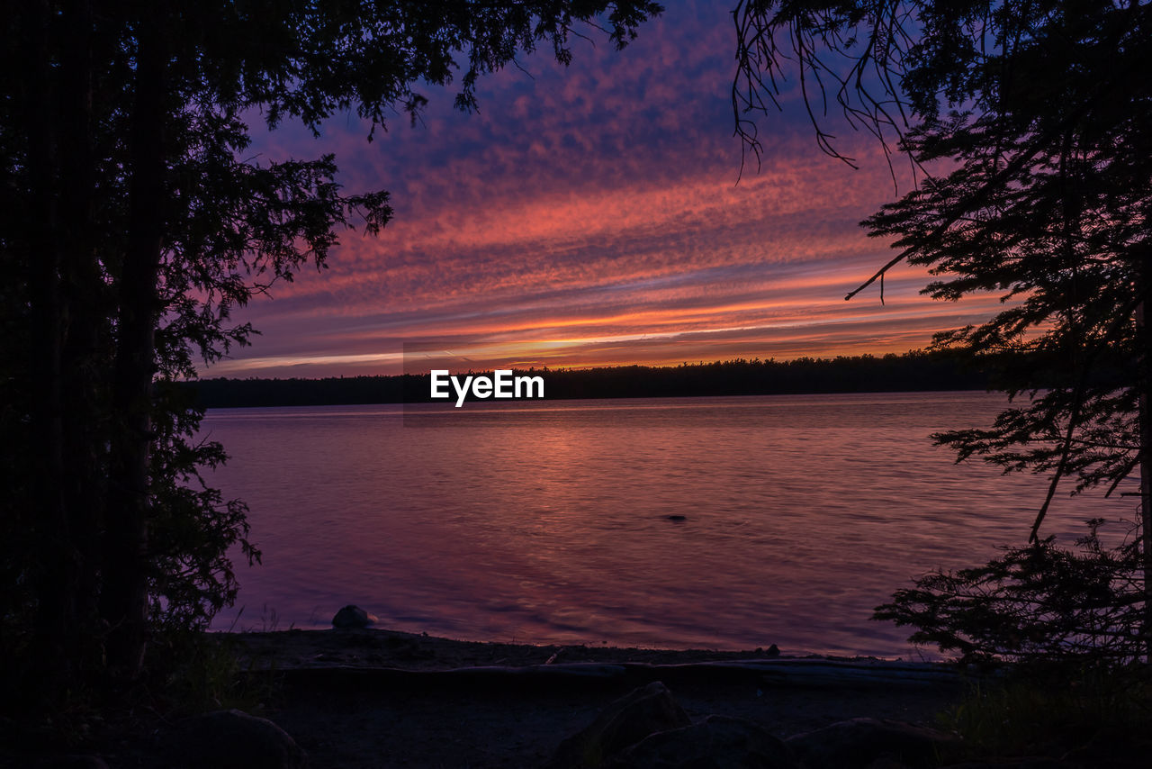 SCENIC VIEW OF LAKE AGAINST ROMANTIC SKY