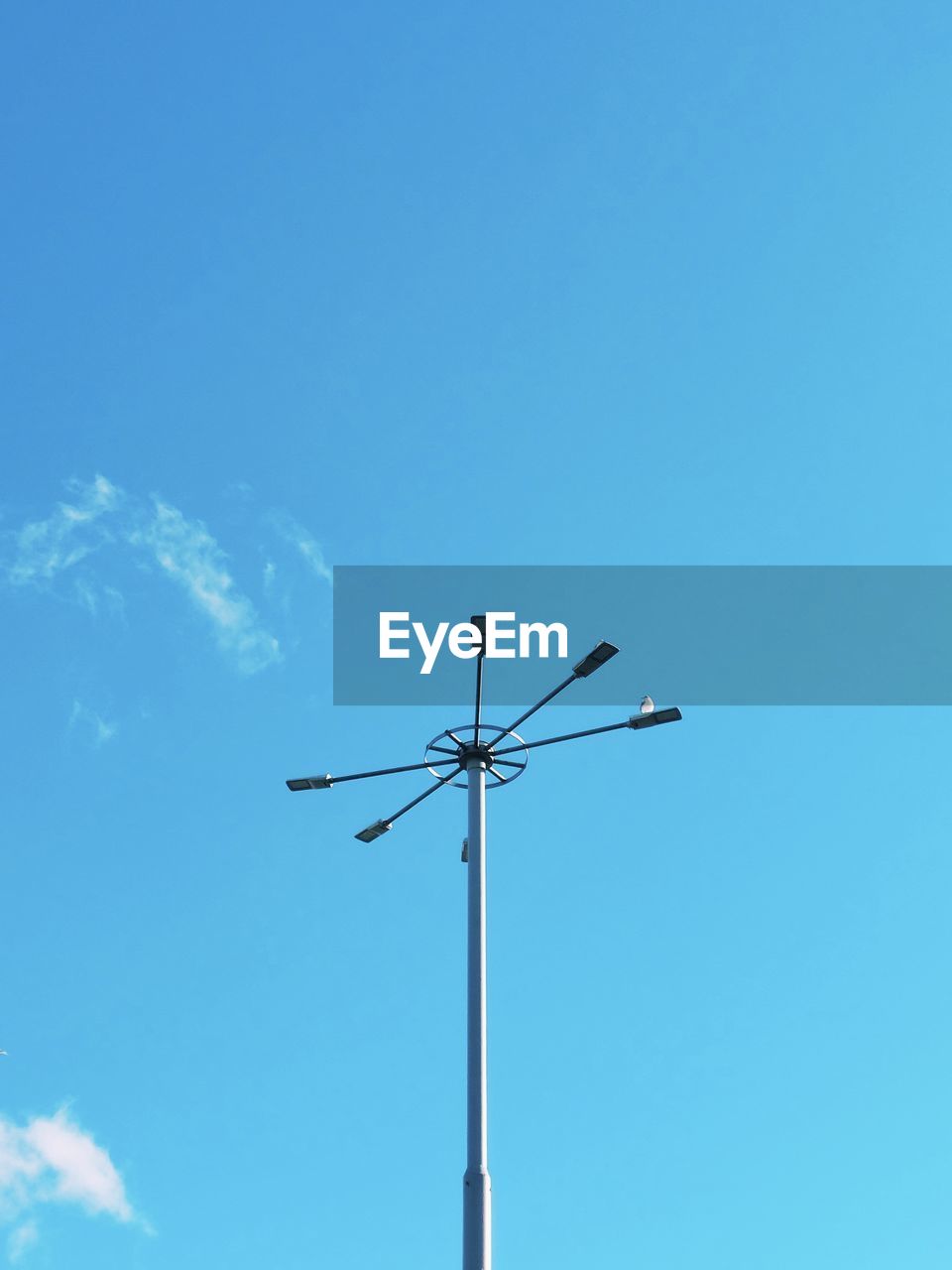 low angle view of street light against clear blue sky