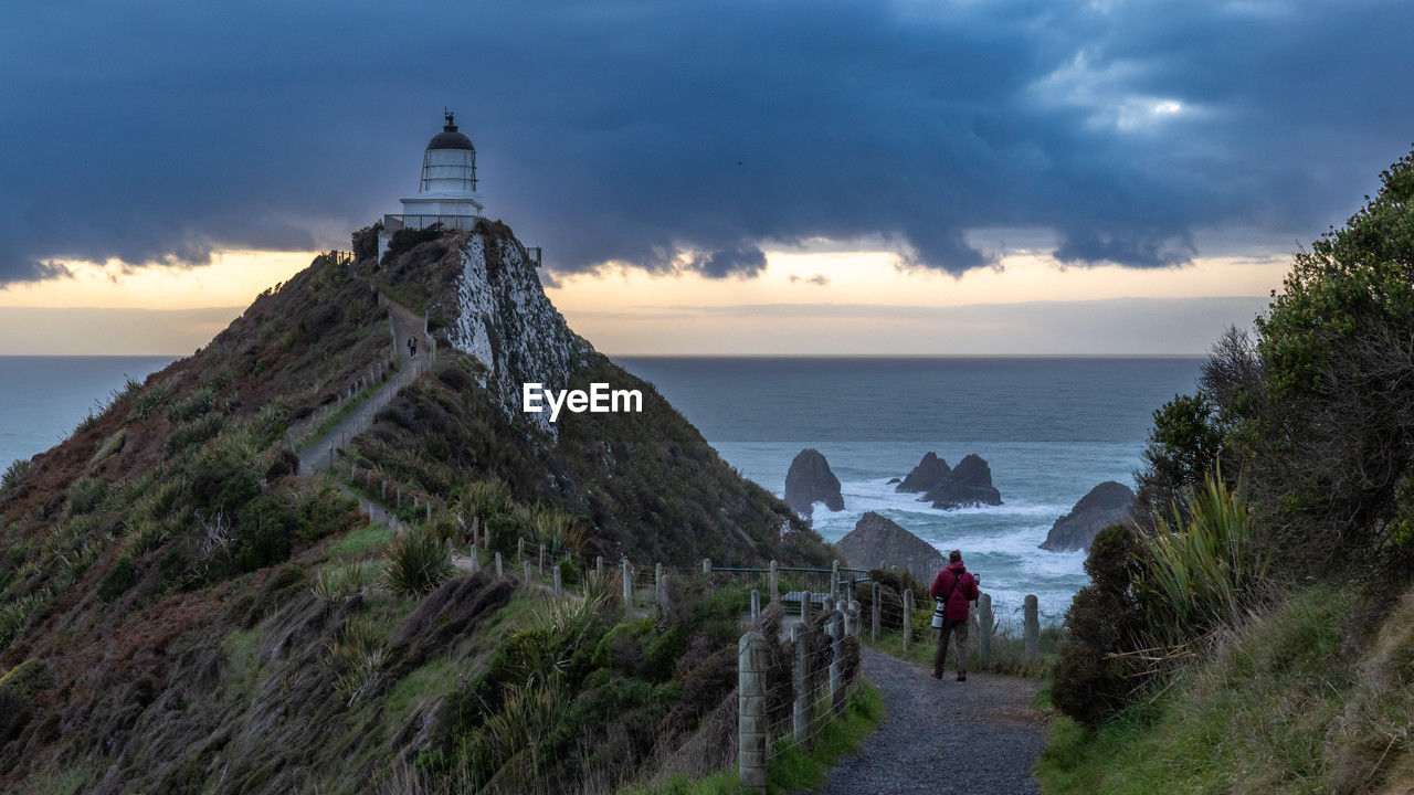 A beautiful sunrise at nugget point lighthouse, new zealand 