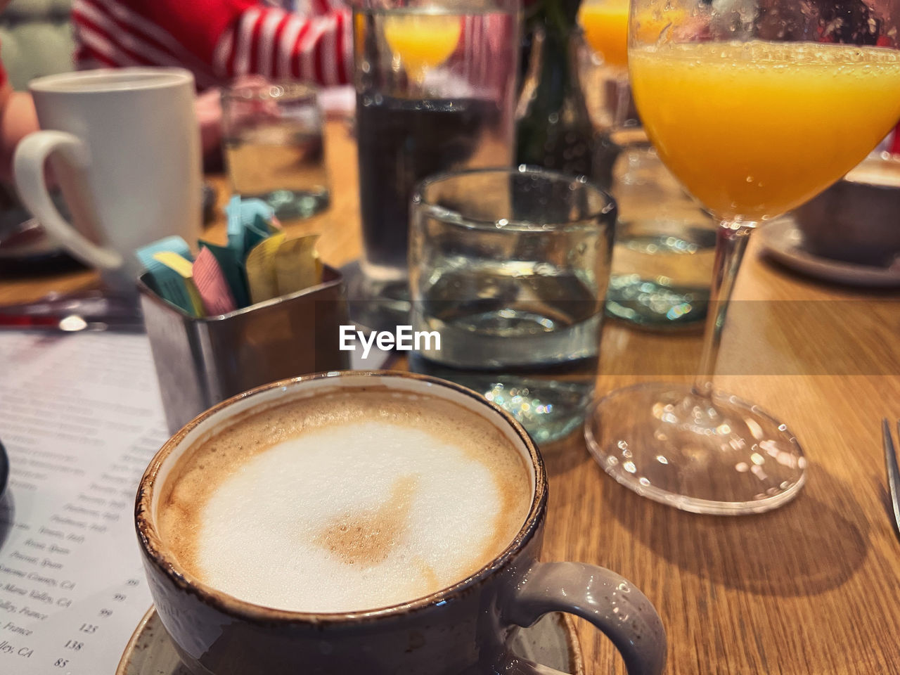 drink, food and drink, refreshment, glass, table, food, coffee, drinking glass, still life, household equipment, indoors, freshness, close-up, cup, no people, alcohol, alcoholic beverage, business, frothy drink, mug, coffee cup, focus on foreground, cafe, meal, restaurant, brunch