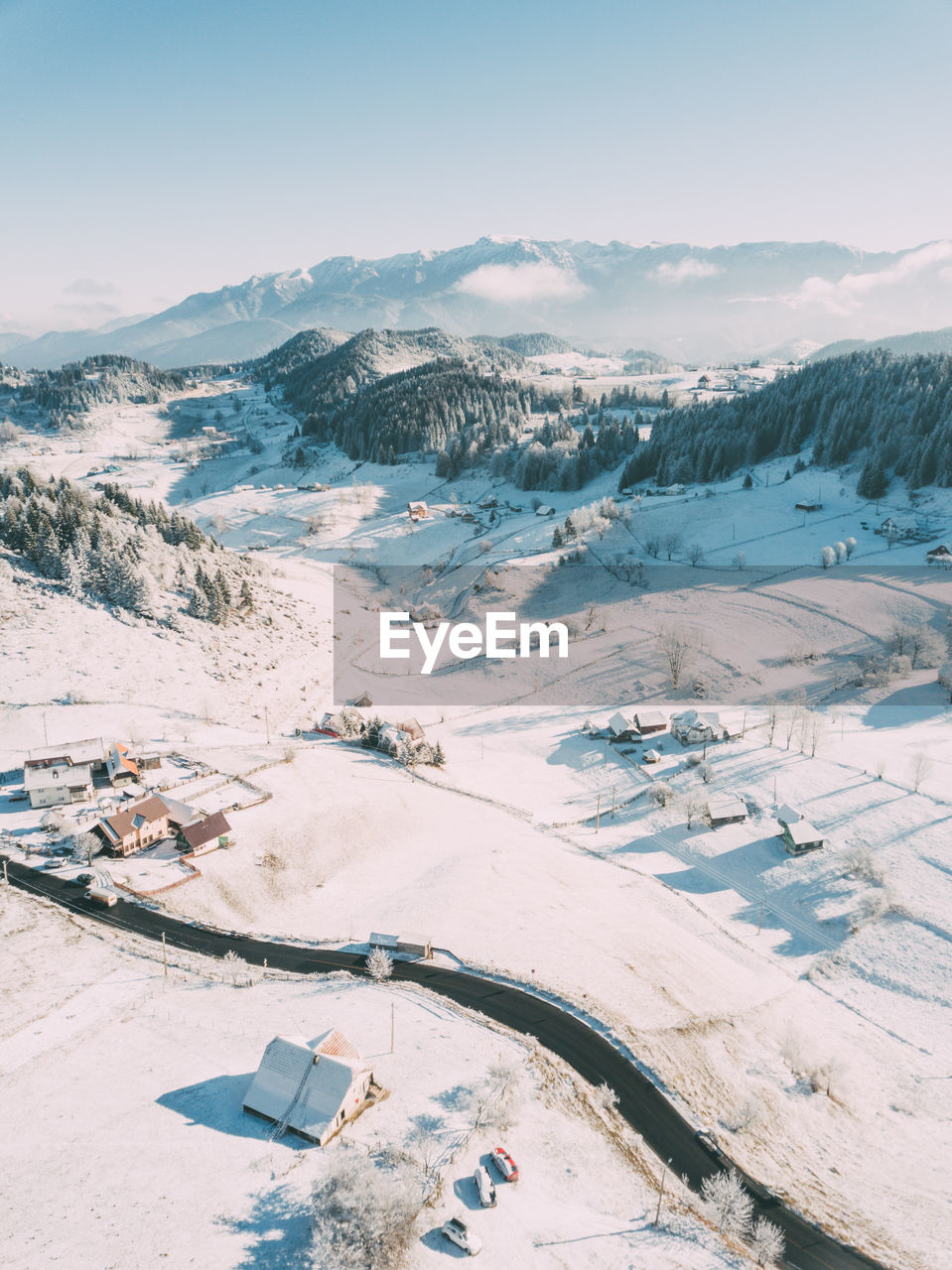 HIGH ANGLE VIEW OF SNOW COVERED LANDSCAPE