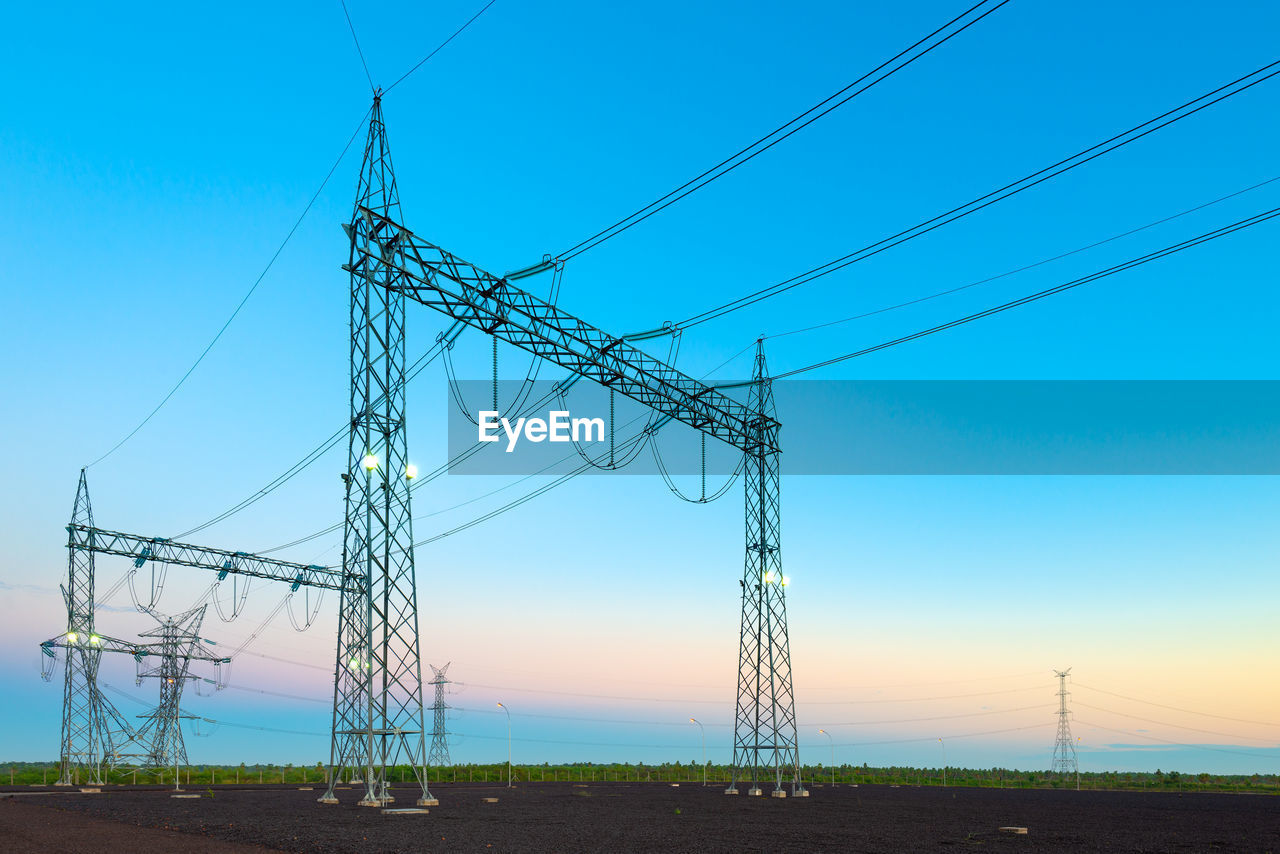 Electric substation and pwer lines in paraguay at dawn.