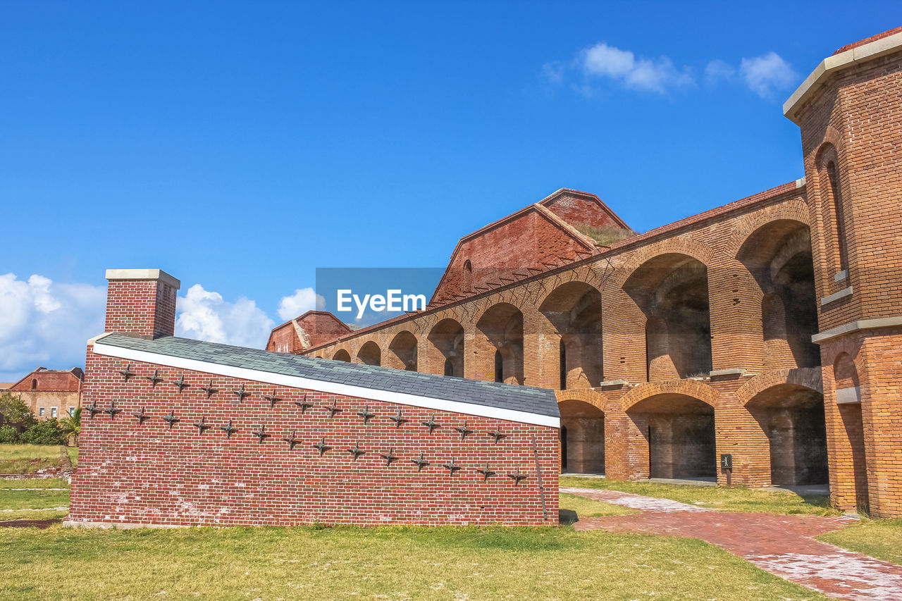 CASTLE BY BUILT STRUCTURE AGAINST SKY