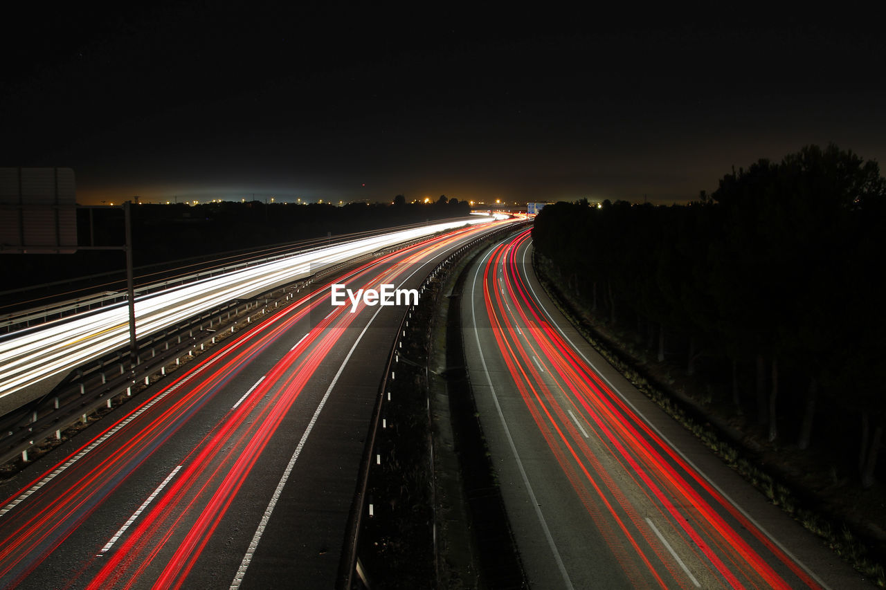 Long exposure shot of highway at night with blurred lights