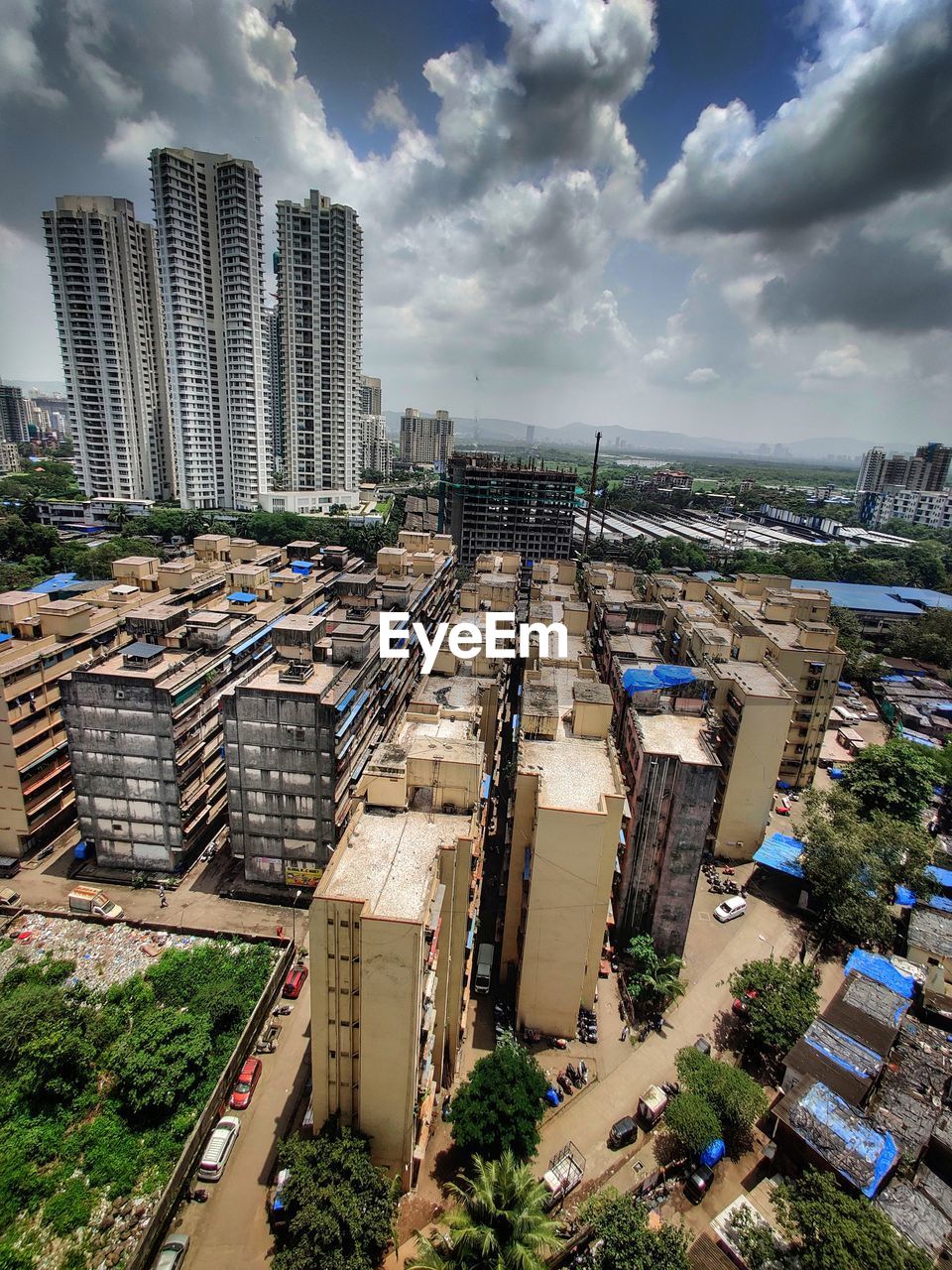 High angle view of buildings in city against sky