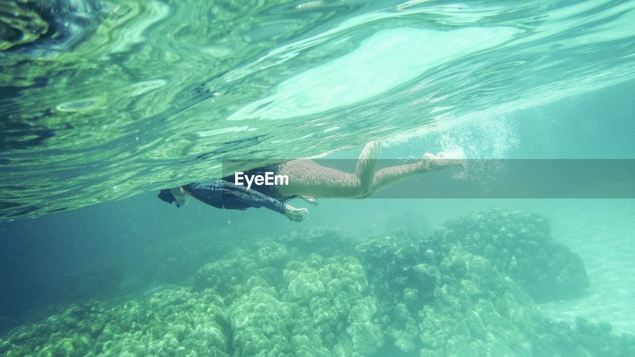 Woman swimming in sea