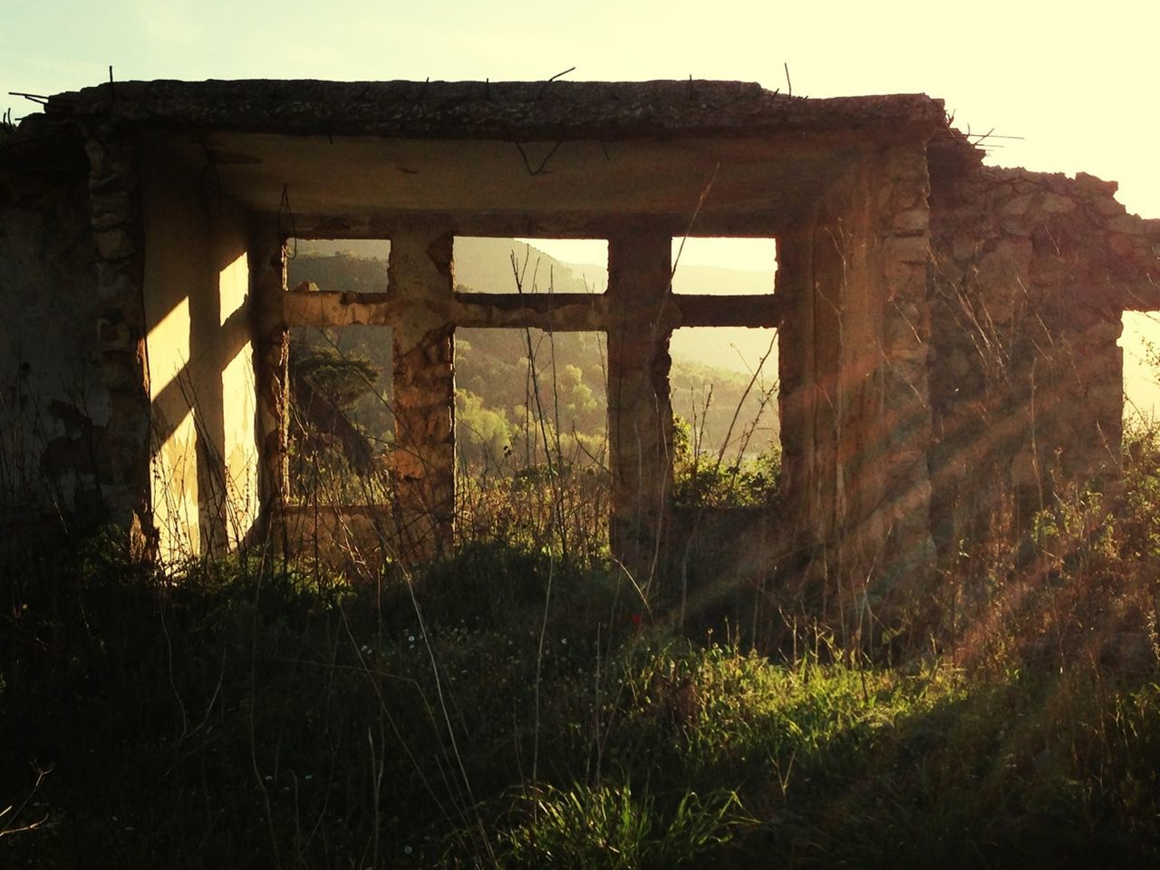 Exterior of old ruined building against clear sky