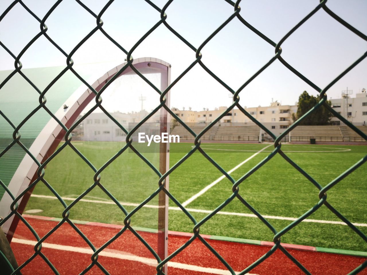 Field seen through chainlink fence