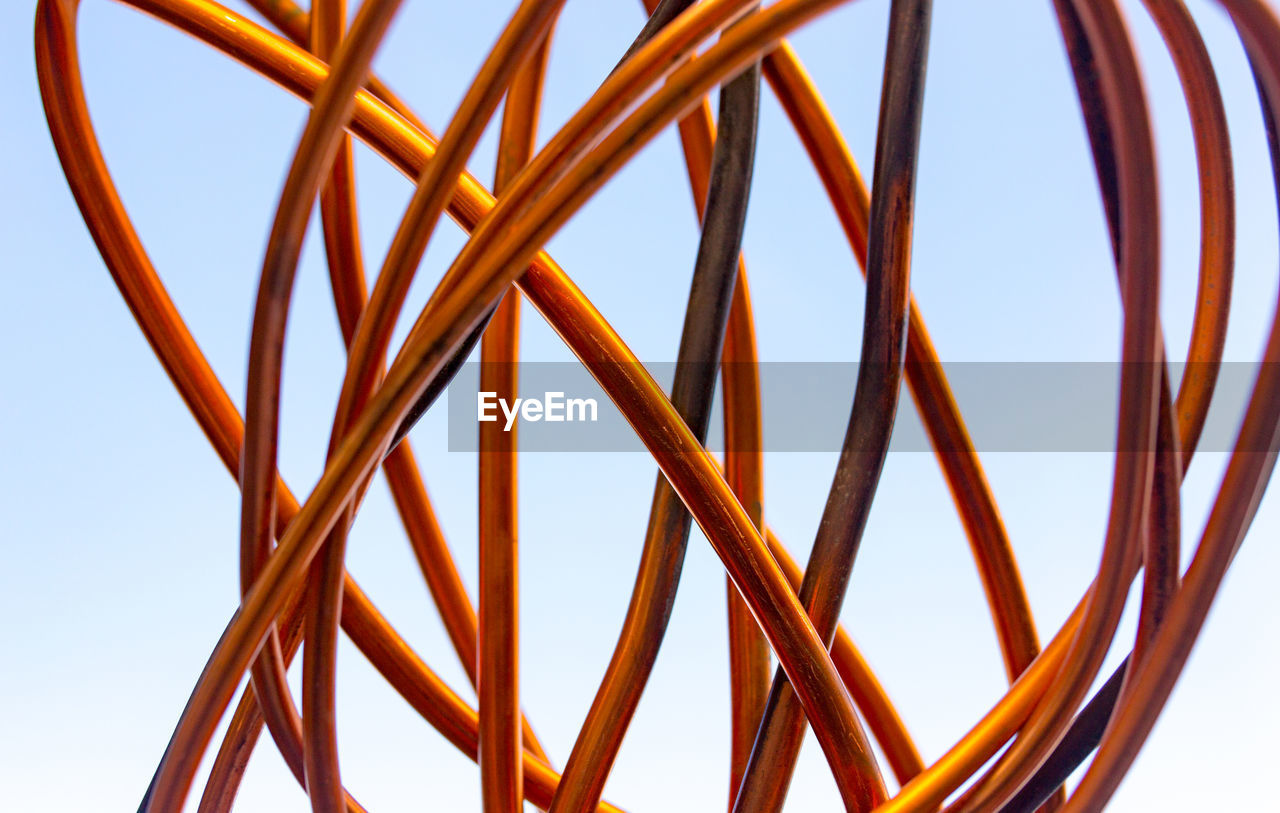 Low angle view of metallic structure against clear sky