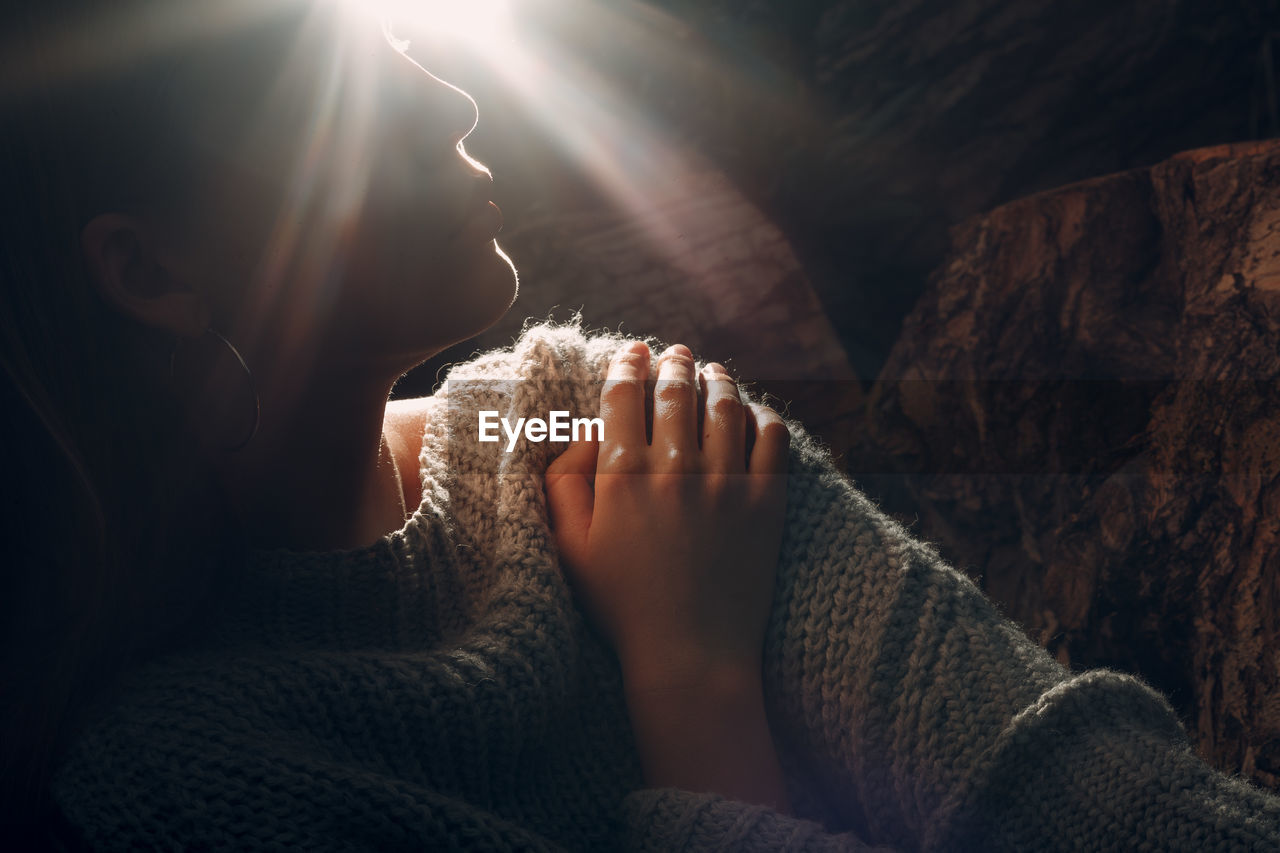 Close-up of couple relaxing in sunlight